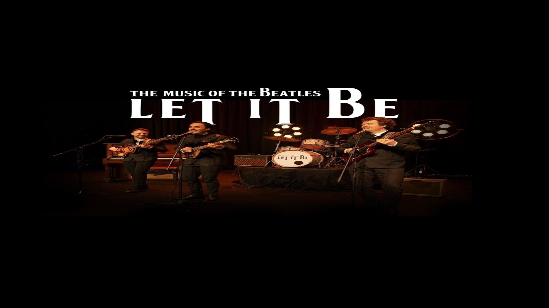 Image is of Beatles tribute band Let it Be playing on stage