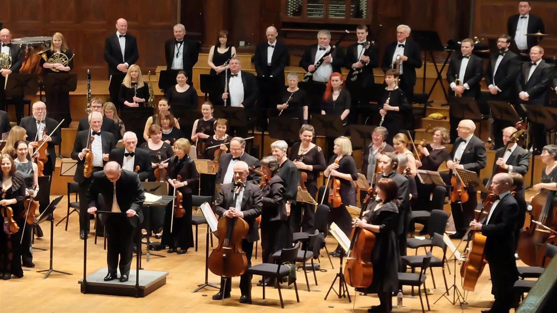 Image is members of the Studio Symphony Orchestra on stage
