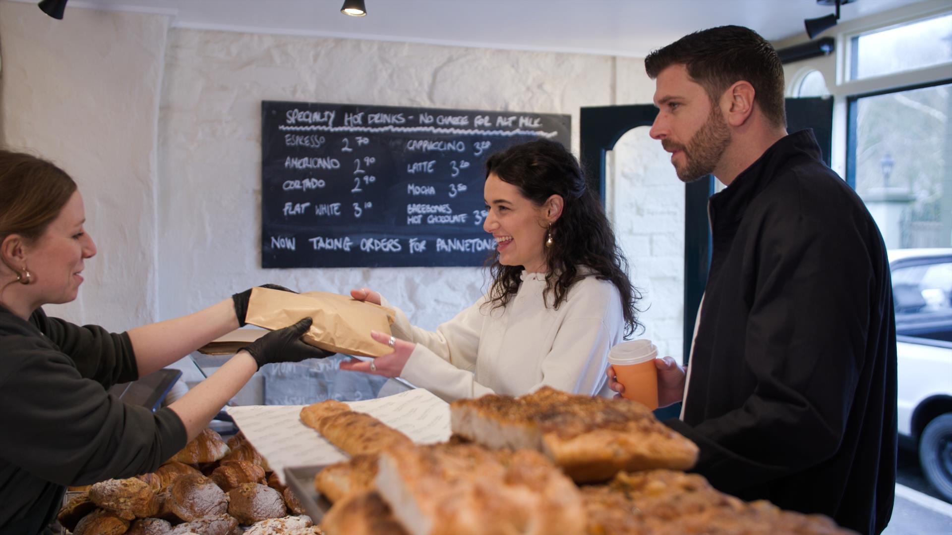 Couple at counter in Roundhouse Bakery