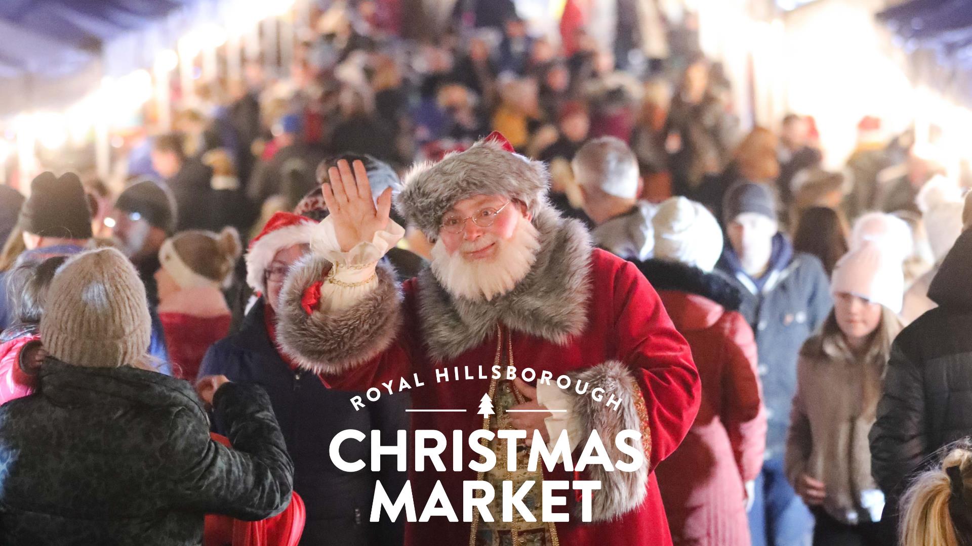 Image is of Santa Claus and visitors at the Royal Hillsborough Christmas Market