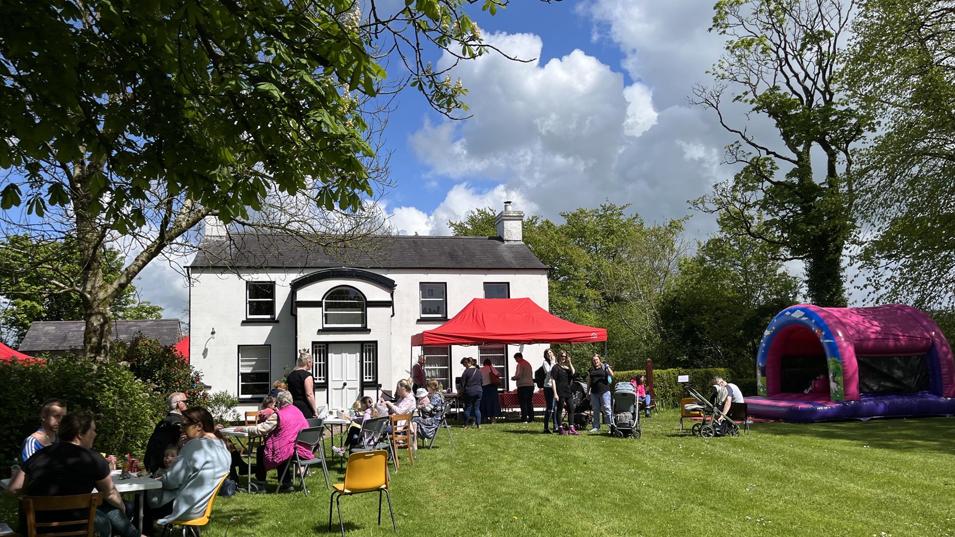 Seating area, BBQ and bouncy castle at the front of The Ballance House
