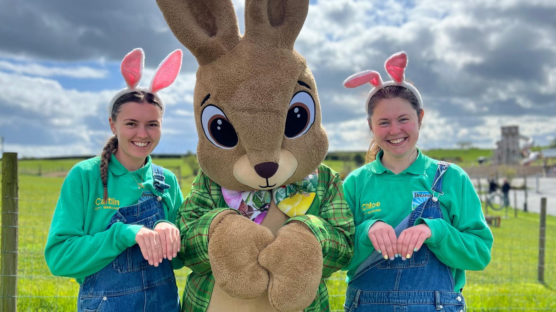 Image shows staff at Streamvale Farm dressed up for Easter with the Easter Bunny.
