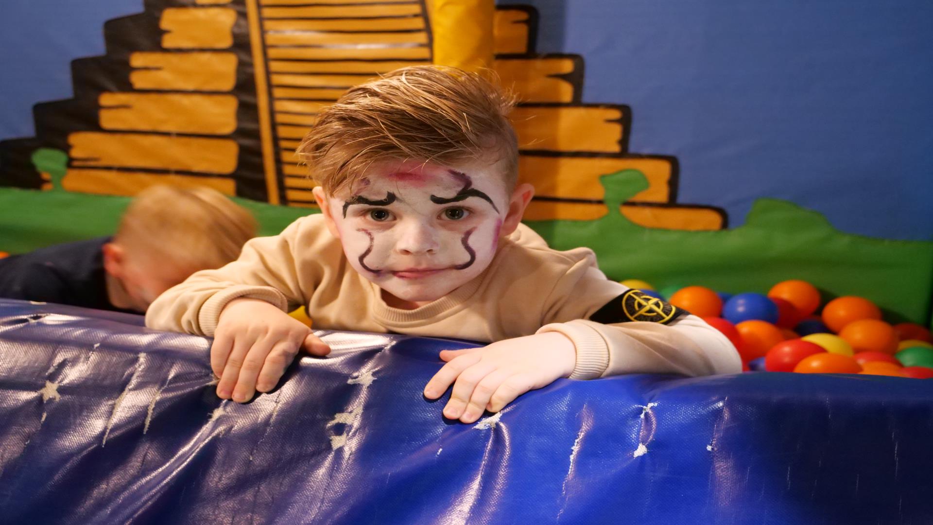 Image shows child with facepaint and Halloween costume at Indiana Land