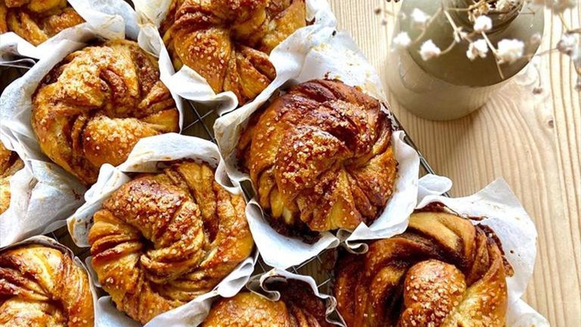 Image shows a selection of bakery items  coated with chocolate from Kin and Folk fine treats.