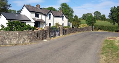 Image shows front of property facing onto country road