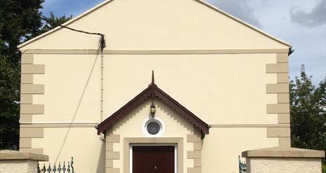 Outside image of the church showing gateway