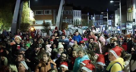 Image is of crowd of people waiting for the Christmas Tree Switch on at Bow Street Lisburn