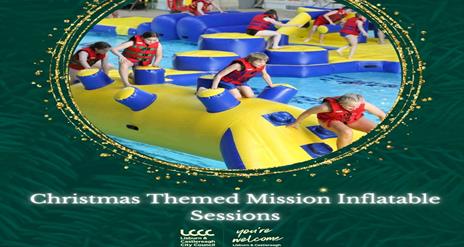 Children Jumping over giant inflatables in the pool