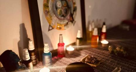 Image is of a treatment room burning candles and incense