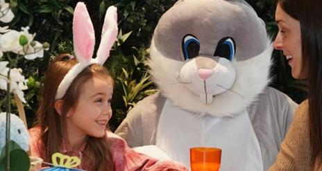 Easter Bunny with little girl and woman.
