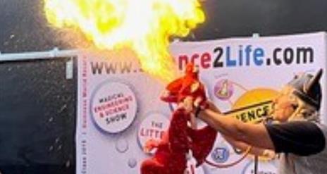 Dragon breathing fire on stage