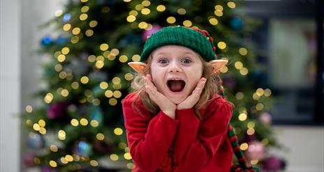 Child dressed as an elf.