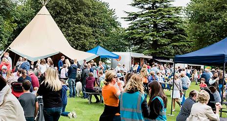 Image shows visitors enjoying food and drink at the Moira Speciality Food Fair