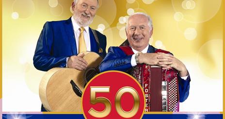 Image is of the singers Foster & Allen with their instruments