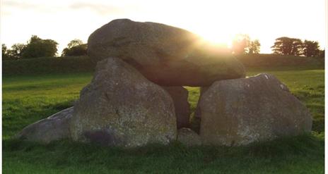 Giants Ring Henge Monument image at Lagan Valley Regional Park with sunrise in the background