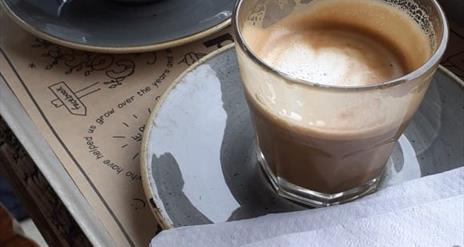 Image is of 2 cups of coffee in Ground Espresso Bar Sprucefield