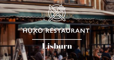 Image shows picture of diners and knife and fork logo at Huxo Restaurant