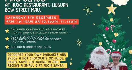 Image is Santa Claus and Mrs Claus ready for breakfast at HUXO restaurant