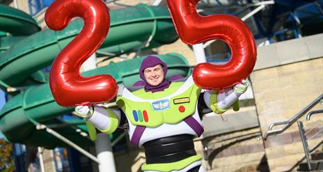 Buzz Lightyear holding 25 balloons outside Lagan Valley Leisureplex
