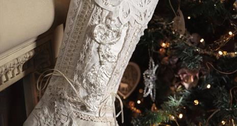 Image is of linen Christmas Stocking hung up on a tree