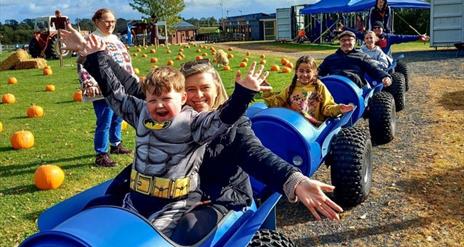 Image is of family at the Pumpkin Patch at Moira Lakes