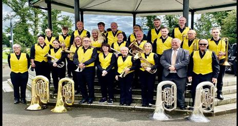 Image is of musicians in Dynamic Brass