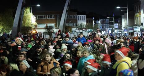 Image is crowd of people at the Lisburn Switch on Christmas event