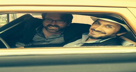 Image is of the musical duo Los Dramaticos