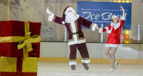 Image is of Santa Claus on the ice at Dundonald Ice Bowl