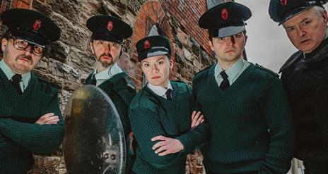 Image shows 4 people dressed in police uniform.