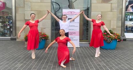 Image shows 4 members of The Wendy Gibson Ballet Academy at the front of the Lisburn Visitor Information Centre, Market Square Lisburn.
