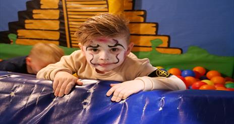 Image shows child with facepaint and Halloween costume at Indiana Land
