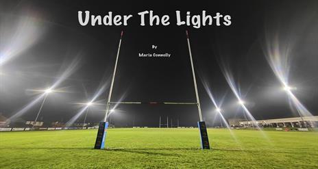 Image is of a rugby field with goalposts pitch lighting