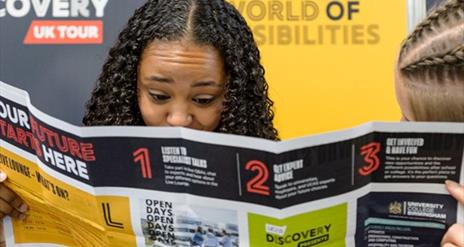 Student reading information sheet