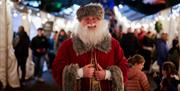 Santa visits Royal Hillsborough Christmas Market and browses the stalls and has a chat with chilldren