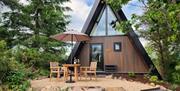 teepee building with seating area outside