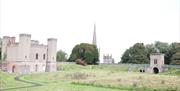 An image from inside the grounds of Hillsborough Fort and the roof top of Saint Malachys Church.