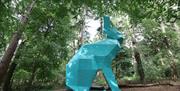 Side view of Peep the Hare through trees in Hillsborough Forest Park