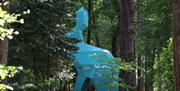 Side view of Peep the Hare through trees in Hillsborough Forest Park