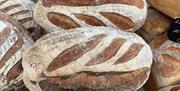 Image shows freshly baked bread on a stall