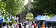 Stall holders and customers on the Dark Walk leading to the fort