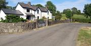 Image shows front of property facing onto country road