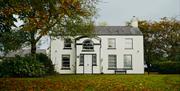 The front view of the house at Autumn time