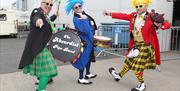 Three members of the Absurdist Pipe Band