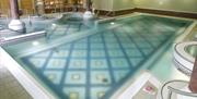 Image shows pool and jacuzzi area