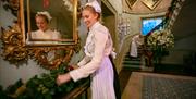 Staff at Hillsborough Castle in Georgian attar decorating the castle for Christmas