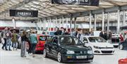 Image is of various cars and visitors at the Dubshed show at Eikon Exhibition Centre
