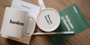 Image shows mugs, notepad and pencil all branded haslem and How you brewin'?
