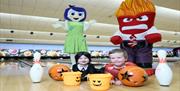 Image shows characters and two children in Halloween Costumes at Dundonald International Ice Bowl