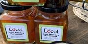 Image shows jars of Irish Whiskey Marmalade on a table at the market